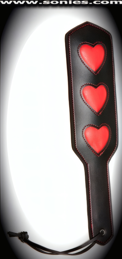Queen of Hearts faux leather paddle with red hearts impression